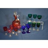 A Victorian cranberry glass flagon together with various coloured glasses (14)
