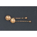 Two Italian silver coin spoons both with ram head finial and decorated stems, (unmarked), the