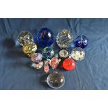 A collection of various coloured and plain glass paperweights to include Sark glass and Medina (13)