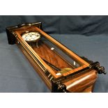 A Viennese wall clock, 107cm x 31cm.