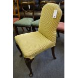 An upholstered salon chair, cabriole leg on pad foot.