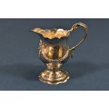 A George III silver baluster shaped cream jug Jacob March or John Moore, London, 1771, the scroll
