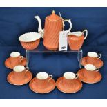 An 15 piece Aynsley bone china coffee set salmon colour with white, gilding to edges with a