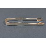 A pair of Channel Islands silver sugar tongs maker's mark GH with crown and J struck twice (George