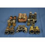 A collection of field glasses/binoculars and opera glasses. (8)