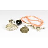 A small group of vintage jewellery including a silver ormer shell brooch; a French silver medallion,