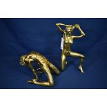 A pair of contemporary Taiwanese polished bronze nude figures one of a kneeling female with arms