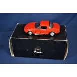 A Kyosho 1/18 scale diecast model of a Mazda Miata MX-5, red, with outer card box only