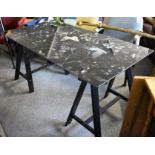 An Ikea black floral design glass table top with black trestle legs (150cm x 80cm)