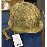 A WW2 German M40 steel helmet with liner and strap, no decals, rolled edge.