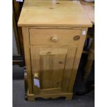 A pine bedside table with drawer.