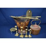 A copper kettle and coal bucket together with a brass trivet, skimmer, four candlesticks and