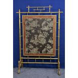 A large 19th century giltwood simulated bamboo firescreen in the George III manner with gold pleated