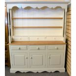 A modern country cottage / farmhouse painted pine kitchen dresser of traditional form, painted in