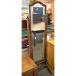 A 1920's oak cheval mirror.