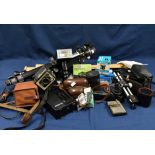 A quantity of various vintage cameras and accessories to include a Slik 88 tripod, Voightlander Vito
