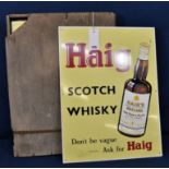 A wooden box of five identical Haig Gold Label Scotch Whiskey vintage metal advertising signs with