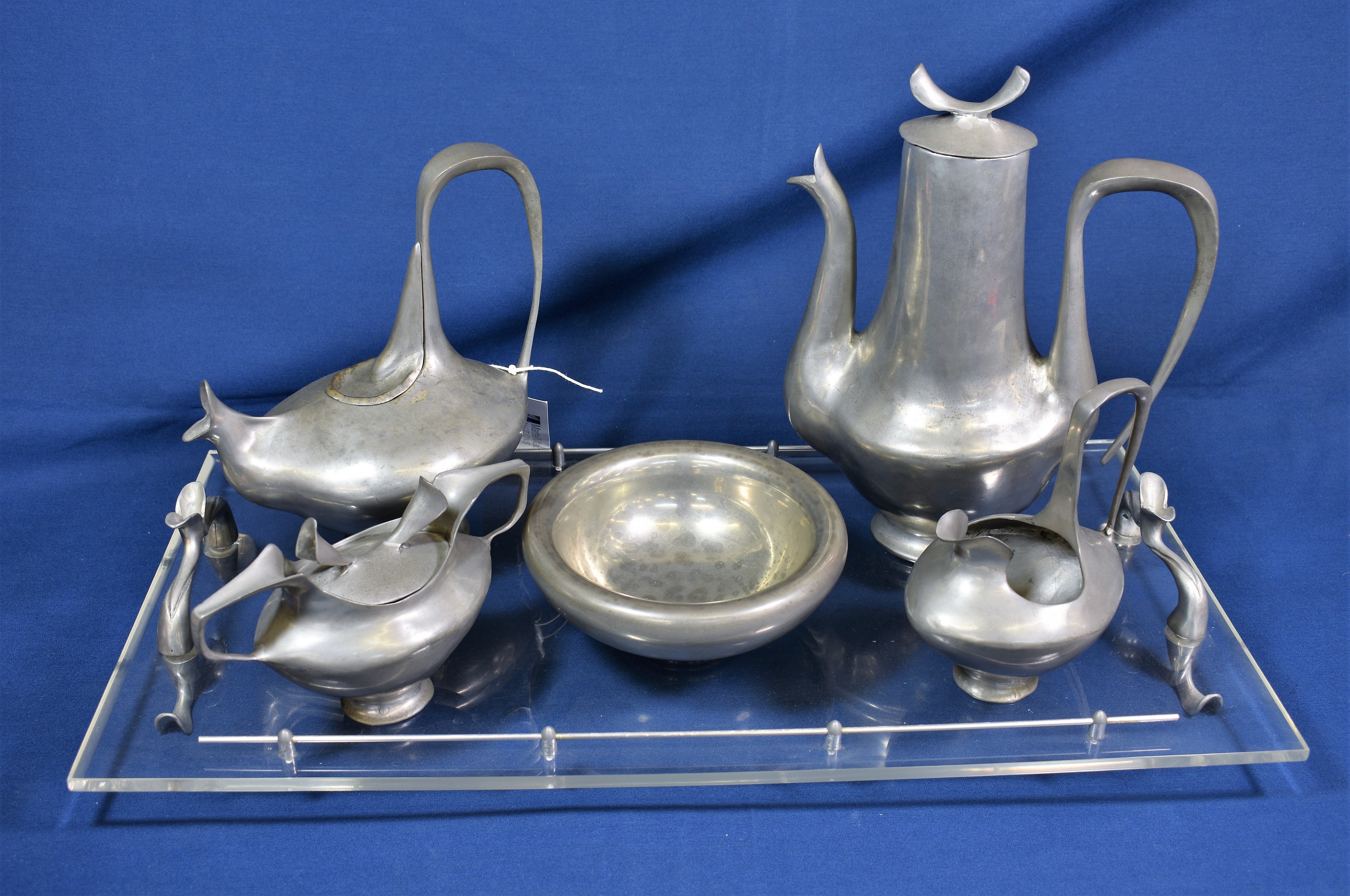 A modernist pewter tea and coffee service by Castor Cooper no. 19 from an edition of 500, comprising