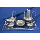 A modernist pewter tea and coffee service by Castor Cooper no. 19 from an edition of 500, comprising