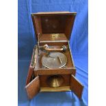 A c1930's Dousona wind-up gramophone + records.