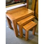 A modern solid oak nest of tables, the largest to measure 63 x 44cm, height 54cm. (3)