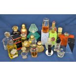 A variety of assorted perfume bottles to include Nina Ricci, Yves Saint Laurent, Mary Quant and