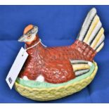 A ceramic Staffordshire chicken egg basket.