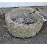 A weathered granite circular trough 20.5in diameter.
