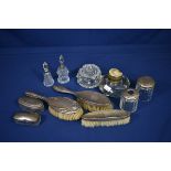 A collection of silver mounted dressing table accessories early 20th century, together with a cut