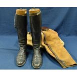 A pair of leather riding boots with fitted boot blocks/trees contained in zip up canvas bag,