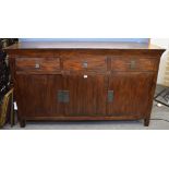 An modern Oriental style sideboard, three drawers with square metal handles above three cupboards