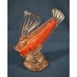 A Murano blown glass carp fish sculpture the clear glass fish over an orange interior highlighted