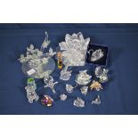 A quantity of various Swarovski ornaments a boxed swan, lotus flower with glass stand,