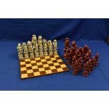 An animal themed resin chess set with board.