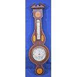 An Edwardian mahogany and marquetry inlaid aneroid barometer with silvered dial, signed Maine