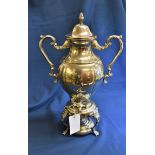 A large twin handled silver plate samovar.