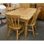 A stripped pine dining table (155.5cm x 76.5cm high) with five matching chairs (6)
