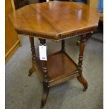 An Edwardian octagonal shaped occasional table on castors.