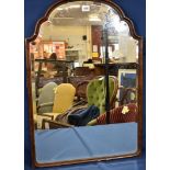 A 1920's carved mahogany mirror with bevelled plate.