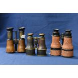 Three pairs of early 20th century military binoculars to include a pair of WW1 US Navy night
