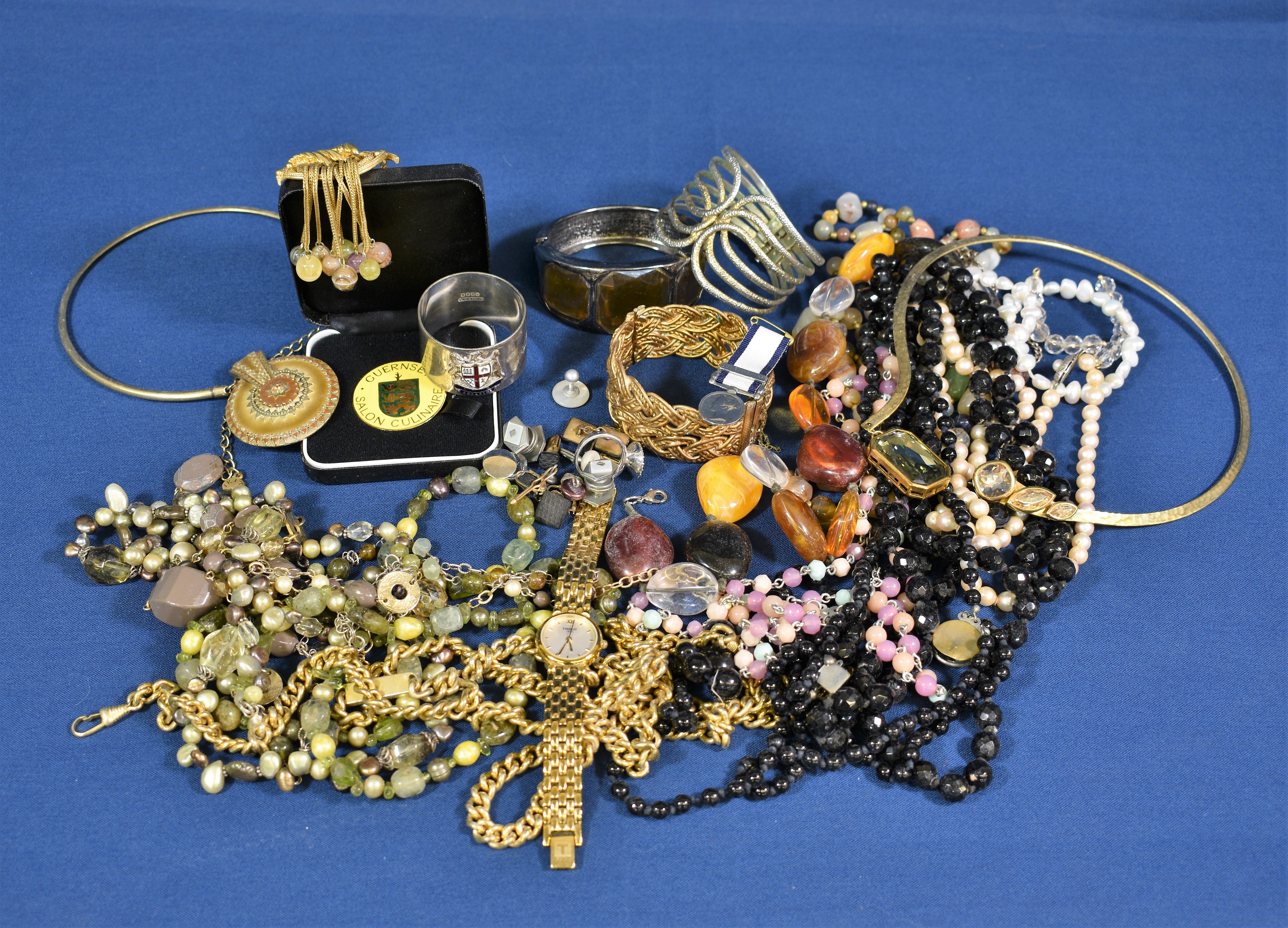 A box of silver and costume jewellery