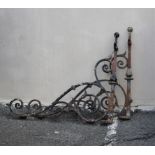 A pair of wrought iron hanging basket or sign brackets.