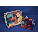 A Vulcan Senior childs sewing machine in original box.