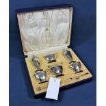 A cased George VI Art Deco six piece cruet set Mappin & Webb, London 1938, tapered square form