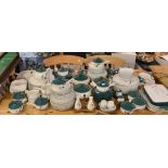 A large quantity of Denby Greenwheat pattern tableware to include plates, lidded soup bowls,