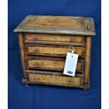 A Regency miniature apprentice piece chest of drawers with birds eye maple veneers, marquetry inlaid