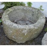 A weathered granite circular trough 24in diameter