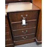 A mahogany filing cabinet the bank of four faux drawers to the front opening to reveal two pull-