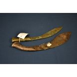 An early all steel Kukri c.1740, the handle with engraved floral decoration, 16 3/4in. (42.5cm.)