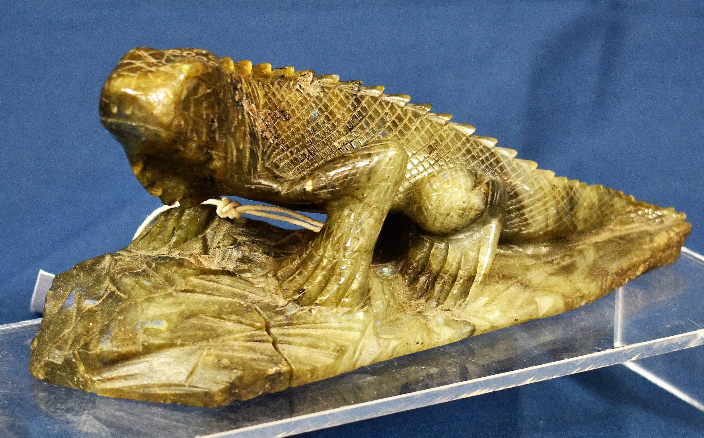 A carved labradorite figure of a gecko, 8in. (20.5cm.) long